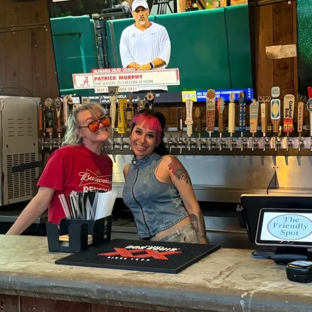 Friendly Spot staff behind the bar