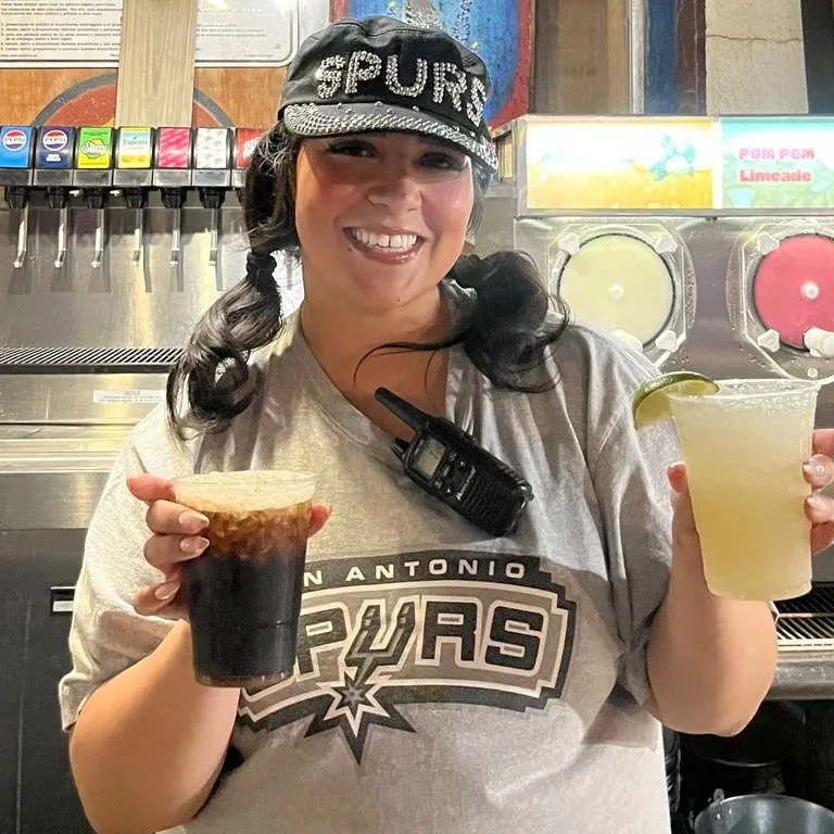 Staff holding drinks, ready to serve